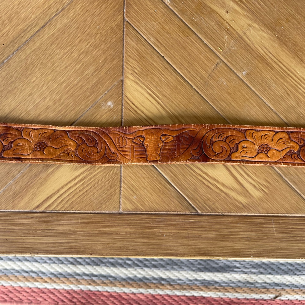 Tooled vintage western leather belt. 30in. No buckle included.